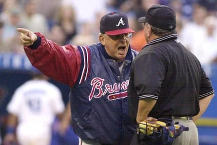 Bobby Cox argues with an umpire during an MLB game.